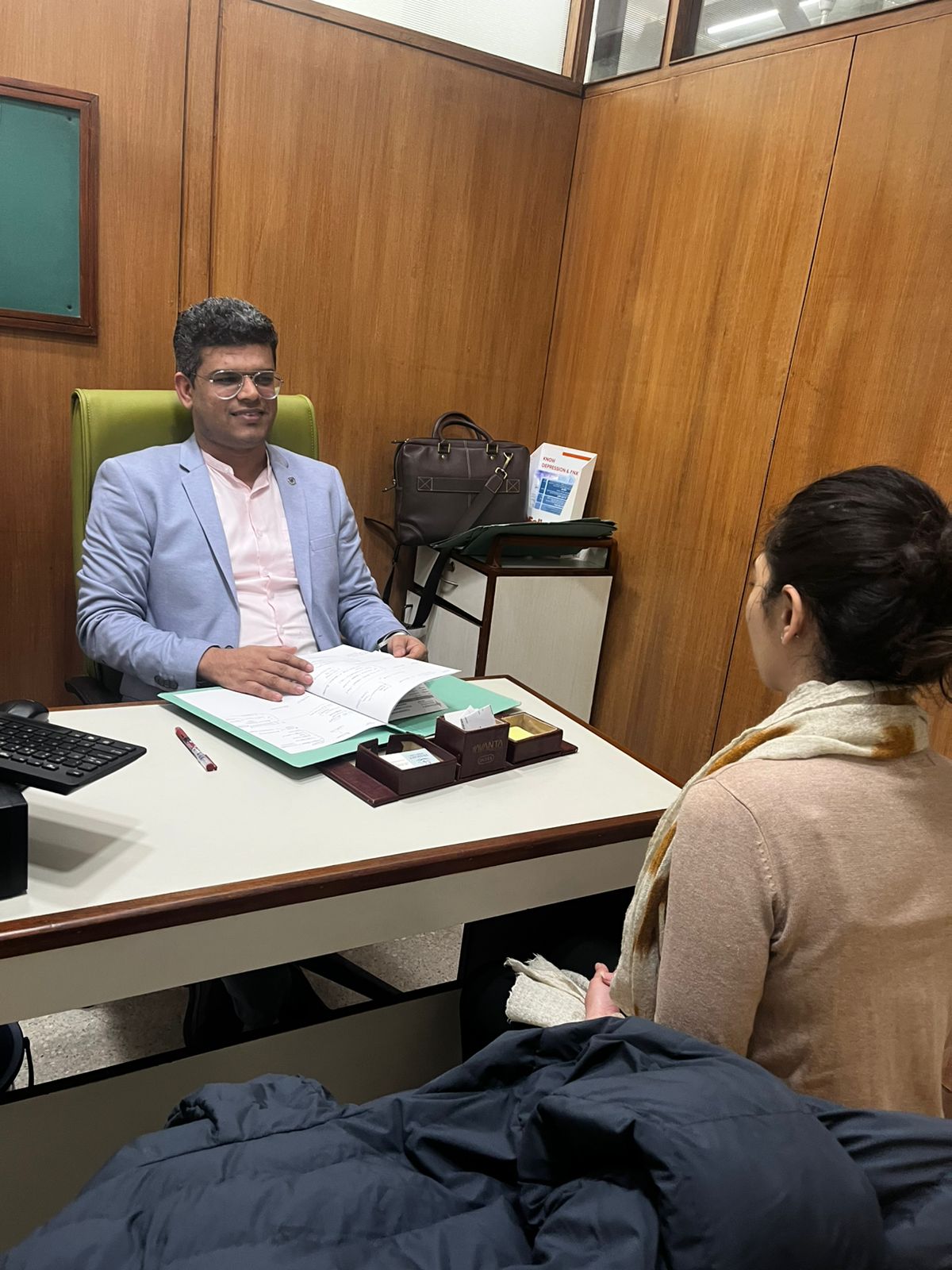 Dr. Jitender Jakhar in consultation with a patient at Insight Mind Care clinic